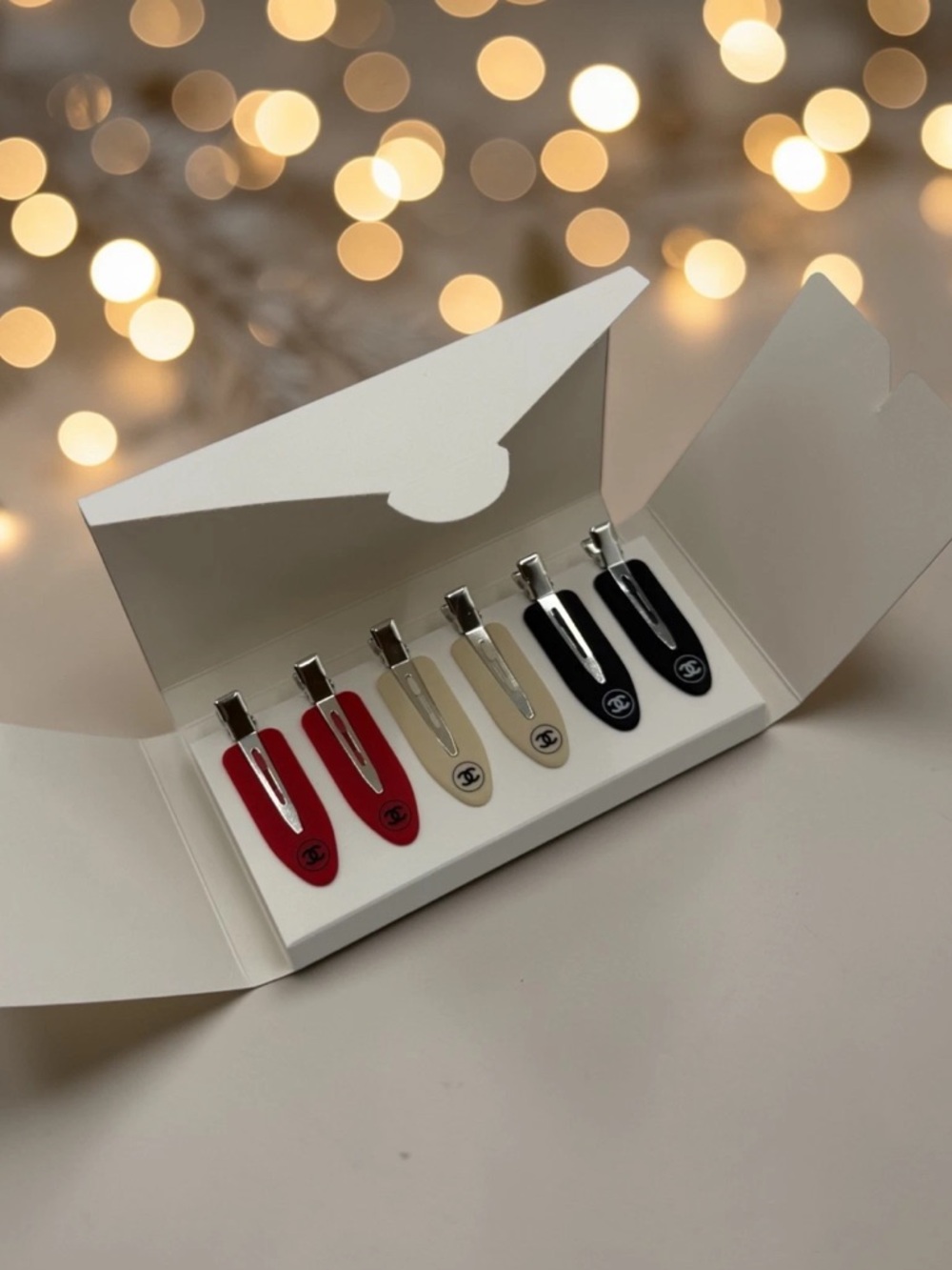 CHANEL Red, Beige, and Black Enamel Logo Hair Clips Set